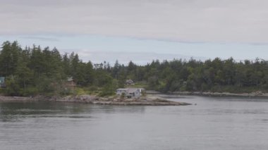 Islands surrounded by ocean and mountains. Summer Season. Gulf Islands near Vancouver Island, British Columbia, Canada. Canadian Landscape.
