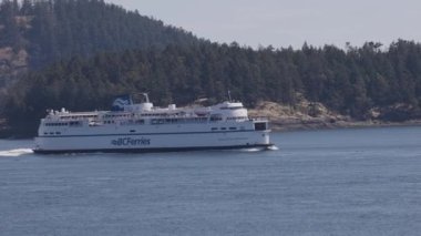 Gulf Islands, British Columbia, Canada - July 14, 2022: BC Ferries Passing By the islands on the West Coast of Pacific Ocean.