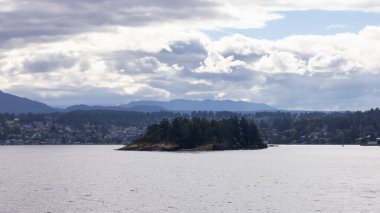 Islands with Trees and Lighthouse surrounded by Homes on a Cloudy Day. Summer Season. Nanaimo., Vancouver Island, British Columbia, Canada. City Background.