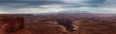 Scenic Panoramic View of American Landscape and Red Rock Mountains in Desert Canyon. Cloudy Sky. Canyonlands National Park. Utah, United States. Nature Background Panorama