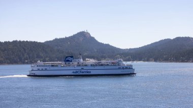 Gulf Islands, British Columbia, Canada - July 14, 2022: BC Ferries Passing By the islands on the West Coast of Pacific Ocean.