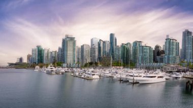 Cinemagraph loop animation. View of Coal Harbour, Marina and Stanley Park. Sunrise Sky Art Render. Downtown Vancouver, British Columbia, Canada.