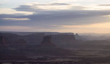 Scenic American Landscape and Red Rock Mountains in Desert Canyon. Spring Season. Canyonlands National Park. Utah, United States. Nature Background. Sunset
