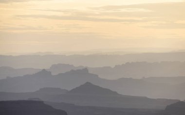 Scenic American Landscape and Red Rock Mountains in Desert Canyon. Spring Season. Canyonlands National Park. Utah, United States. Nature Background. Sunset Sky