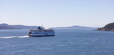 Gulf Islands, British Columbia, Canada - July 14, 2022: BC Ferries Passing By the islands on the West Coast of Pacific Ocean.
