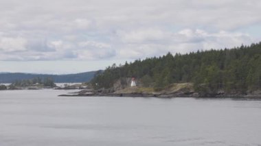 Islands surrounded by ocean and mountains. Summer Season. Gulf Islands near Vancouver Island, British Columbia, Canada. Canadian Landscape.