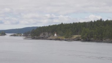 Islands surrounded by ocean and mountains. Summer Season. Gulf Islands near Vancouver Island, British Columbia, Canada. Canadian Landscape.