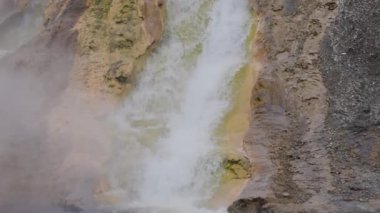 River and Hot spring Geyser with colorful water in American Landscape. Yellowstone National Park, Wyoming, United States. Nature Background, Slow Motion