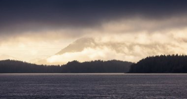 Tofino, Vancouver Island, British Columbia, Canada. View of Canadian Mountain Landscape on the West Coast of Pacific Ocean. Nature Background. Sunset Sky.