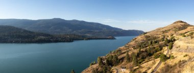 Scenic View of Kalamalka Lake during sunny summer sunrise. Vernon, British Columbia, Canada. Nature Background Panorama