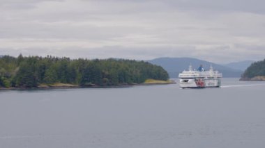 Gulf Islands, British Columbia, Canada - July 14, 2022: BC Ferries Passing By the islands on the West Coast of Pacific Ocean.