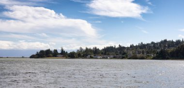 Residential Homes on the West Coast of Pacific Ocean. Sunny and Cloudy Summer Day. Victoria, Vancouver Island, British Columbia, Canada.