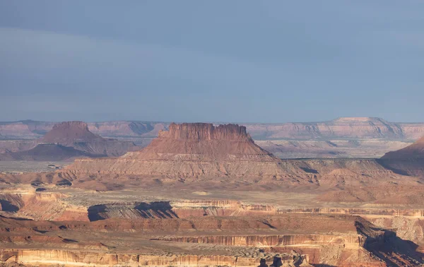 Scenic American Landscape and Red Rock Mountains in Desert Canyon. Spring Season. Canyonlands National Park. Utah, United States. Nature Background. Sunrise