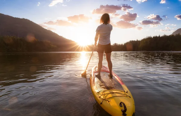 Adventurous Woman Paddling Paddle Board Peaceful Lake Colorful Sunset Art — стоковое фото