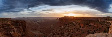 Scenic Panoramic View of American Landscape and Red Rock Mountains in Desert Canyon. Cloudy Sunset Sky. Canyonlands National Park. Utah, United States. Nature Background Panorama