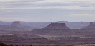 Scenic American Landscape and Red Rock Mountains in Desert Canyon. Spring Season. Canyonlands National Park. Utah, United States. Nature Background. Sunset