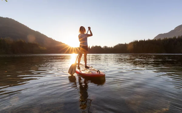Adventurous Woman Paddling Paddle Board Peaceful Lake Sunny Sunset Hicks — Fotografia de Stock