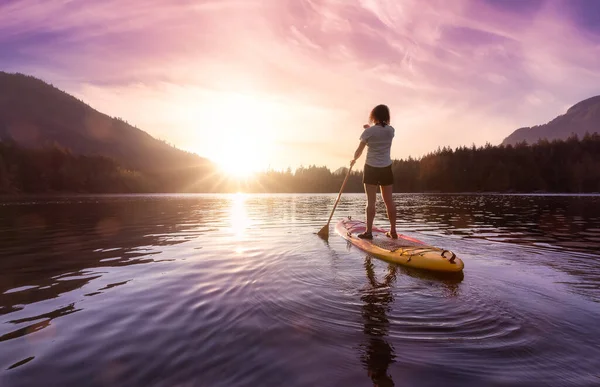 Adventurous Woman Paddling Paddle Board Peaceful Lake Colorful Sunset Art — стоковое фото