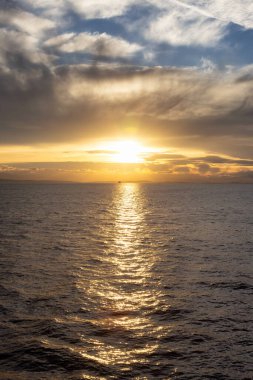 Cloudy Cloudscape during sunny summer Day on the West Coast of Pacific Ocean. British Columbia, Canada. Sunset Sky