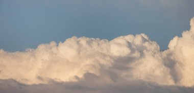 Puff Clouds in the Sky during sunset. Zoom in. Cloudscape Background. British Columbia, Canada.