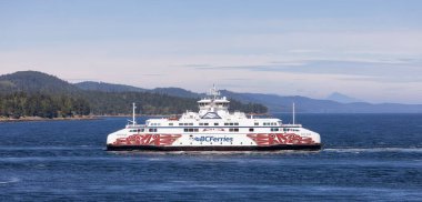 Gulf Islands, British Columbia, Canada - July 14, 2022: BC Ferries Passing By the islands on the West Coast of Pacific Ocean.