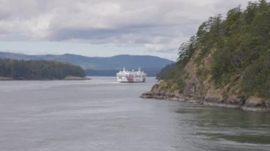 Gulf Islands, British Columbia, Canada - July 14, 2022: BC Ferries Passing By the islands on the West Coast of Pacific Ocean.