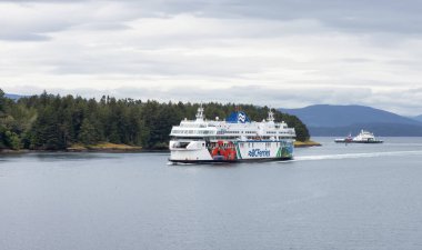 Galiano Island, British Columbia, Canada - June 21, 2022: BC Ferries Boat in Pacific Ocean during cloudy summer day.