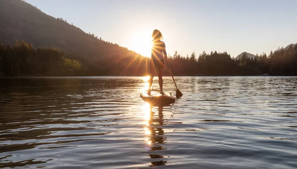 Adventurous Woman Paddling Paddle Board Peaceful Lake Sunny Sunset Hicks — стоковое фото