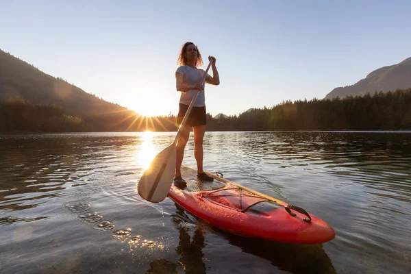 Adventurous Woman Paddling Paddle Board Peaceful Lake Sunny Sunset Hicks — стоковое фото
