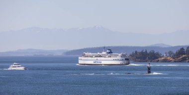 Gulf Islands, British Columbia, Canada - July 14, 2022: BC Ferries Passing By the islands on the West Coast of Pacific Ocean.