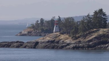 Islands surrounded by ocean and mountains. Summer Season. Gulf Islands near Vancouver Island, British Columbia, Canada. Canadian Landscape.