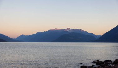 Harrison Lake during Sunny Summer Morning Sunrise. Canadian Nature Landscape Background. Harrison Hot Springs, British Columbia, Canada.