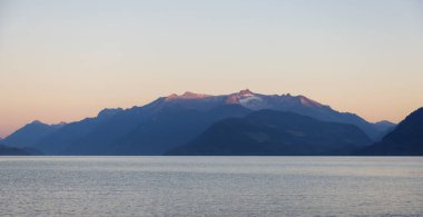Harrison Lake during Sunny Summer Morning Sunrise. Canadian Nature Landscape Background. Harrison Hot Springs, British Columbia, Canada.