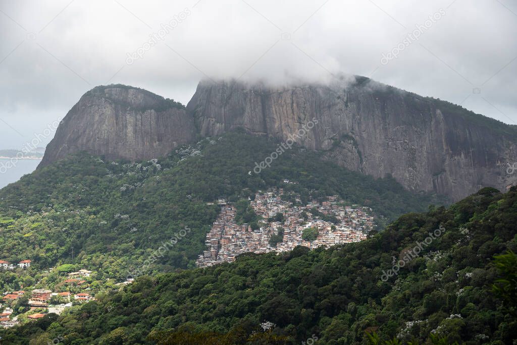 Beautiful view to green rainforest mountain and favela in Rio de Janeiro, Brazil