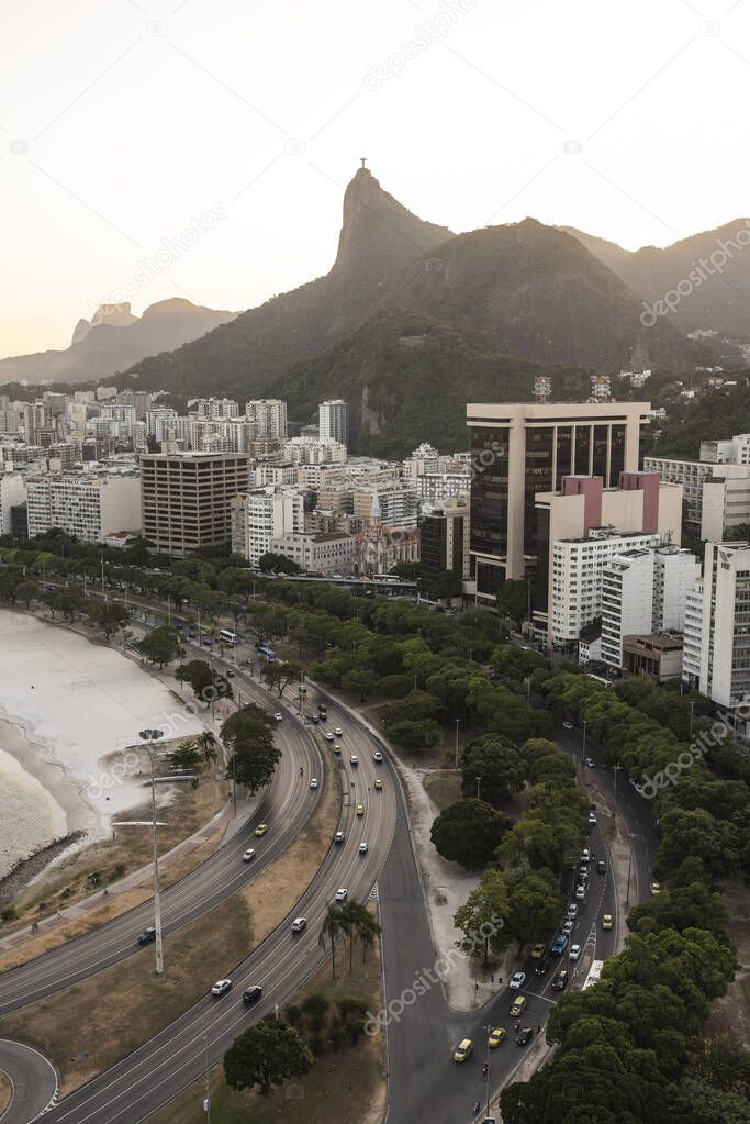 Beautiful sunset view to city beach, buildings and mountains, Rio de Janeiro, Brazil