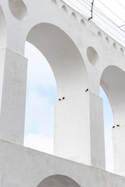 Beautiful view to white old historic aqueduct in downtown Lapa district, Rio de Janeiro, Brazil