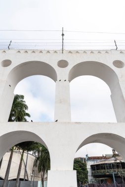 Beautiful view to white old historic aqueduct in downtown Lapa district, Rio de Janeiro, Brazil