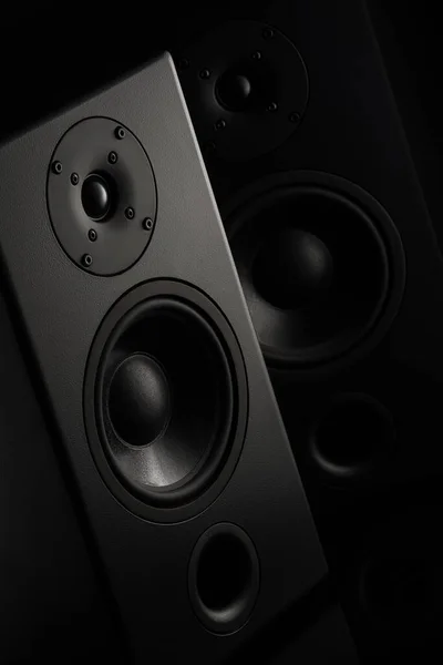Stereo sound speakers closeup on black background with copy space