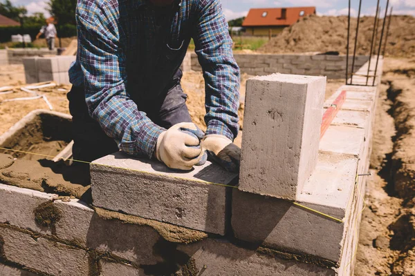 Professional Construction Worker Laying Bricks Mortar Building External House Walls Imagen de stock