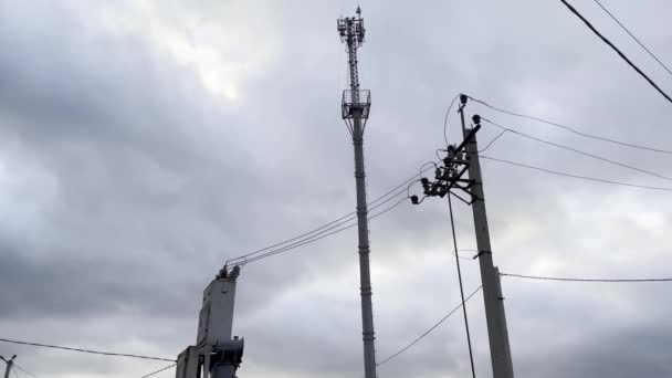 Electric transformer connected to the power supply system. And a Cell tower. — Stock Video