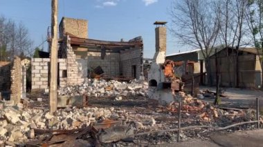Horenka, village near Kyiv, UKRAINE, 2022. . Only the fireplace remains. Completely destroyed brick house of civilians, Ruins during russian aggression and military invasion of Ukraine. 