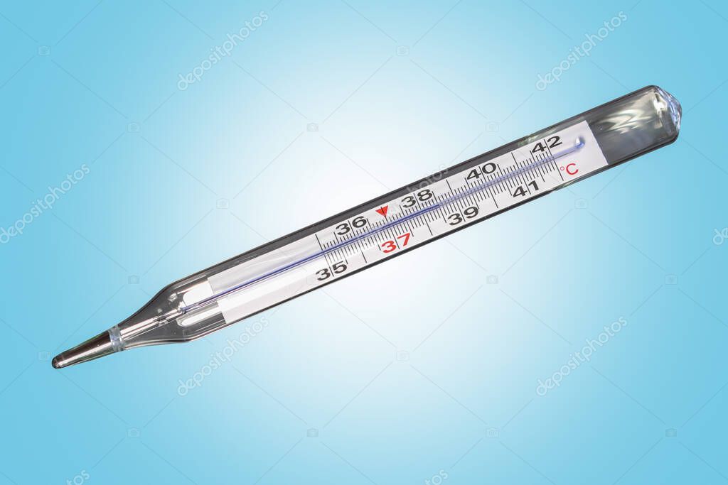 Analog clinical thermometer, mercury free, calibrated in degrees centigrade indicating a temperature of 38.5 degrees centigrade. Fever or illness concept