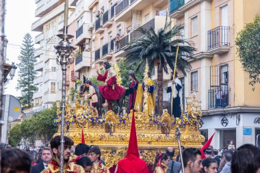 Huelva, Spain - April 10, 2022: Throne or platform of the Brotherhood of the La Borriquita, in procession by the narrow streets of the city