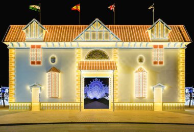 Illuminated doorway for the 2022 Colombine festivities, which recreates one of the 274 homes in the Reina Victoria neighborhood, also known as Barrio Obrero