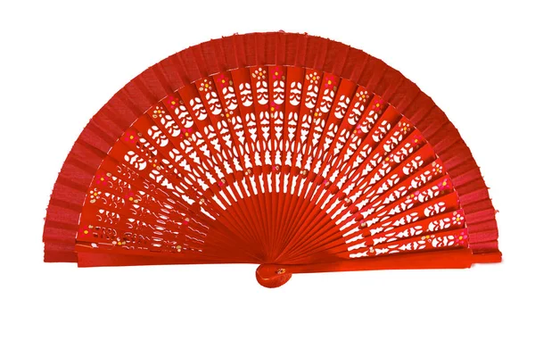 Spanish red open hand fan, decorated with floral motifs, isolated on white background