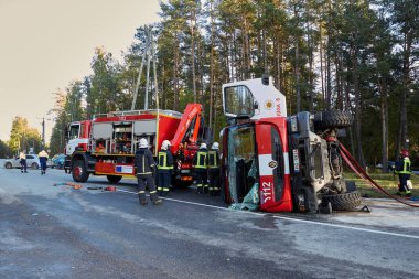 September 25, 2021,Upesciems Latvia: car accident on a road, fire truck after a collision with a car, transportation background