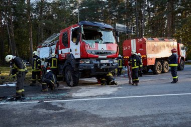 September 25, 2021,Upesciems Latvia: car accident on a road, fire truck after a collision with a car, transportation background