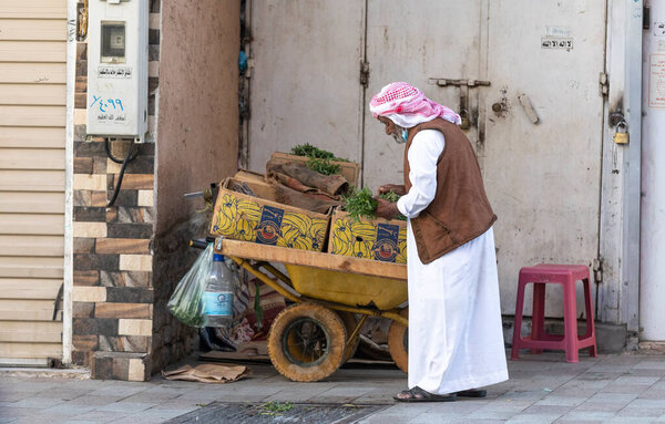 Taif, Saudi Arabia, 5th January 2022: old man at the Taif market selling herbs