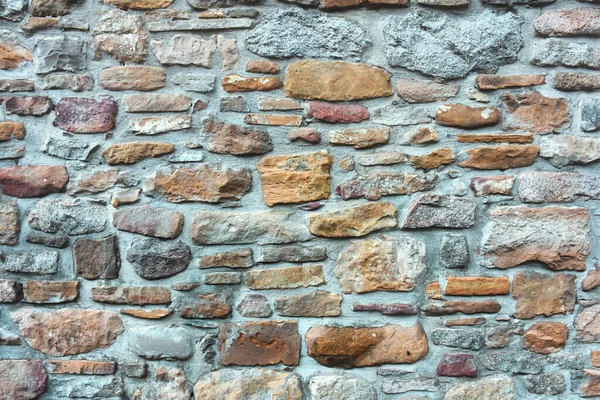 Arkaplan Olarak Renkli Taşlardan Yapılmış Eski Bir Duvar Mavi Tonlar — Stok fotoğraf