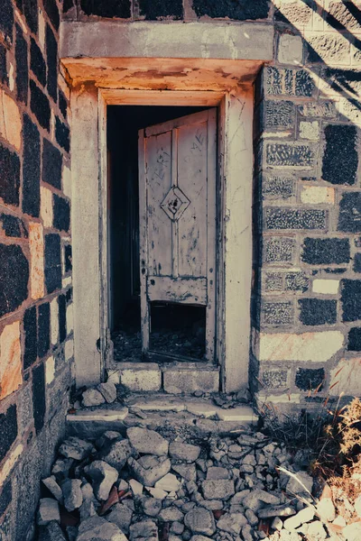 An old abandoned house with window and door. Vintage abandoned house.